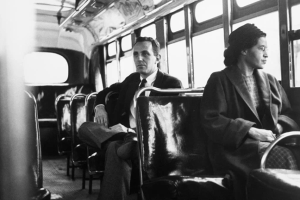 Rosa Parks seated on a bus, taken in 1956 to commemorate the end of the Montgomery Bus Boycott, which she helped spark by refusing to give up her seat in 1955.